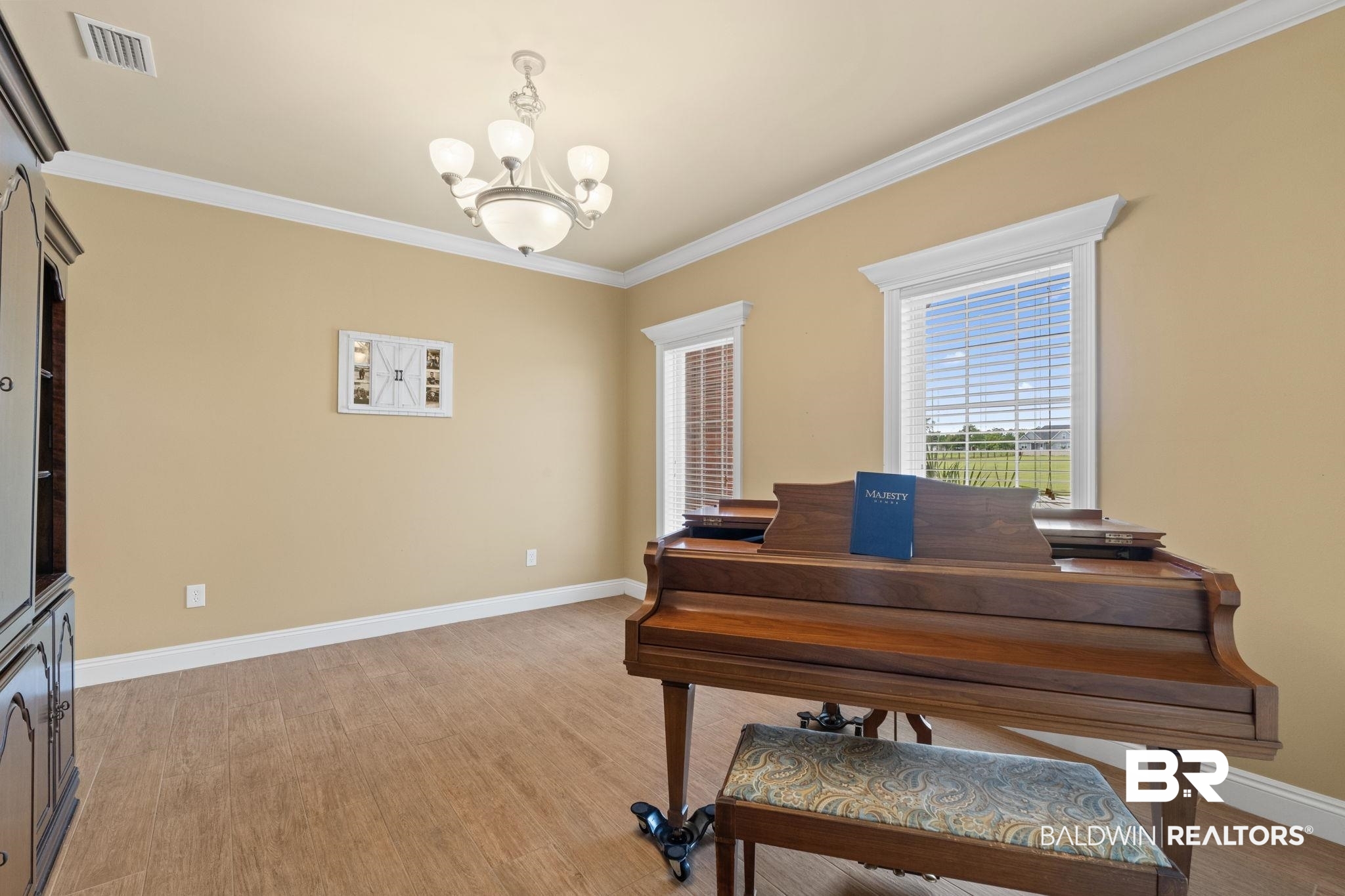 9790 Stucki Road Elberta, AL 36530 - Photo 28 of 72 Office space with a chandelier, ornamental molding, light wood-style floors, and baseboards