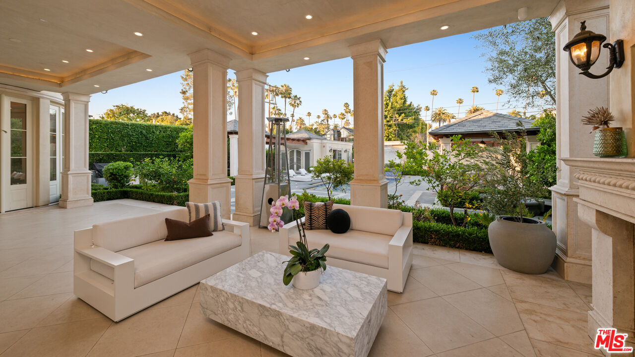 718 North Rodeo Drive Beverly Hills, CA 90210 - Photo 14 of 51 a living room with furniture and a large window