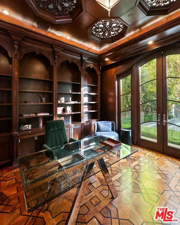 a bathroom with a large mirror and a sink