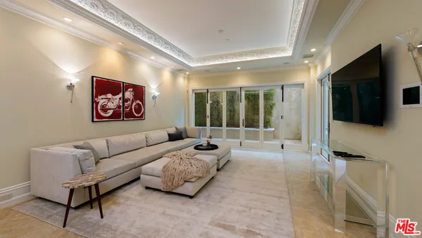 a view of living room with furniture and wooden floor
