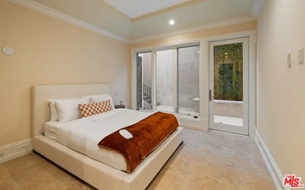 a bedroom with a bed and a table