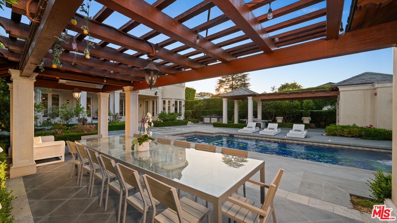 718 North Rodeo Drive Beverly Hills, CA 90210 - Photo 50 of 51 a dining room with furniture and a patio