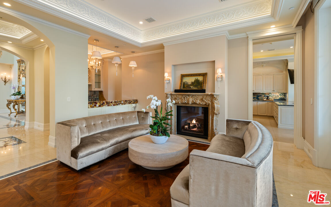 718 North Rodeo Drive Beverly Hills, CA 90210 - Photo 10 of 51 a living room with furniture and a fireplace