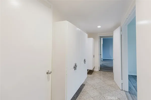 a view of a hallway with toilet
