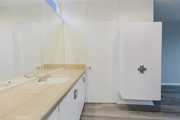 a bathroom with a sink and a mirror