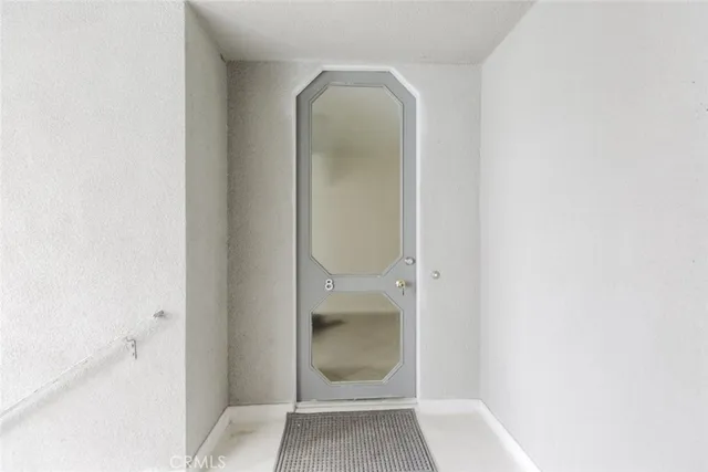a bathroom with a glass shower door