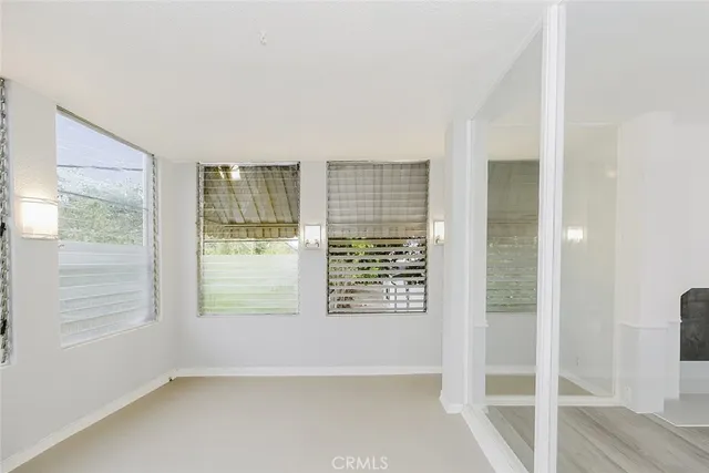 an empty room with windows