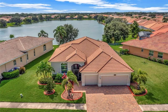 a view of a house with a yard and a table