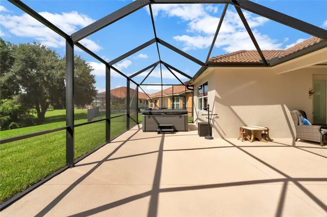 a view of a patio with a table and chairs