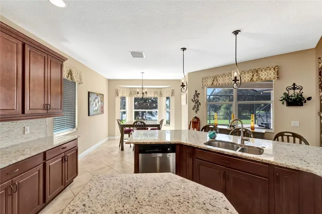 a kitchen with counter top space and sink