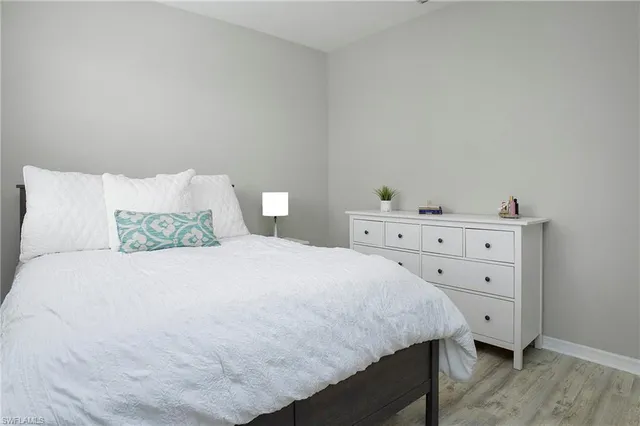 a bedroom with a bed and a dresser