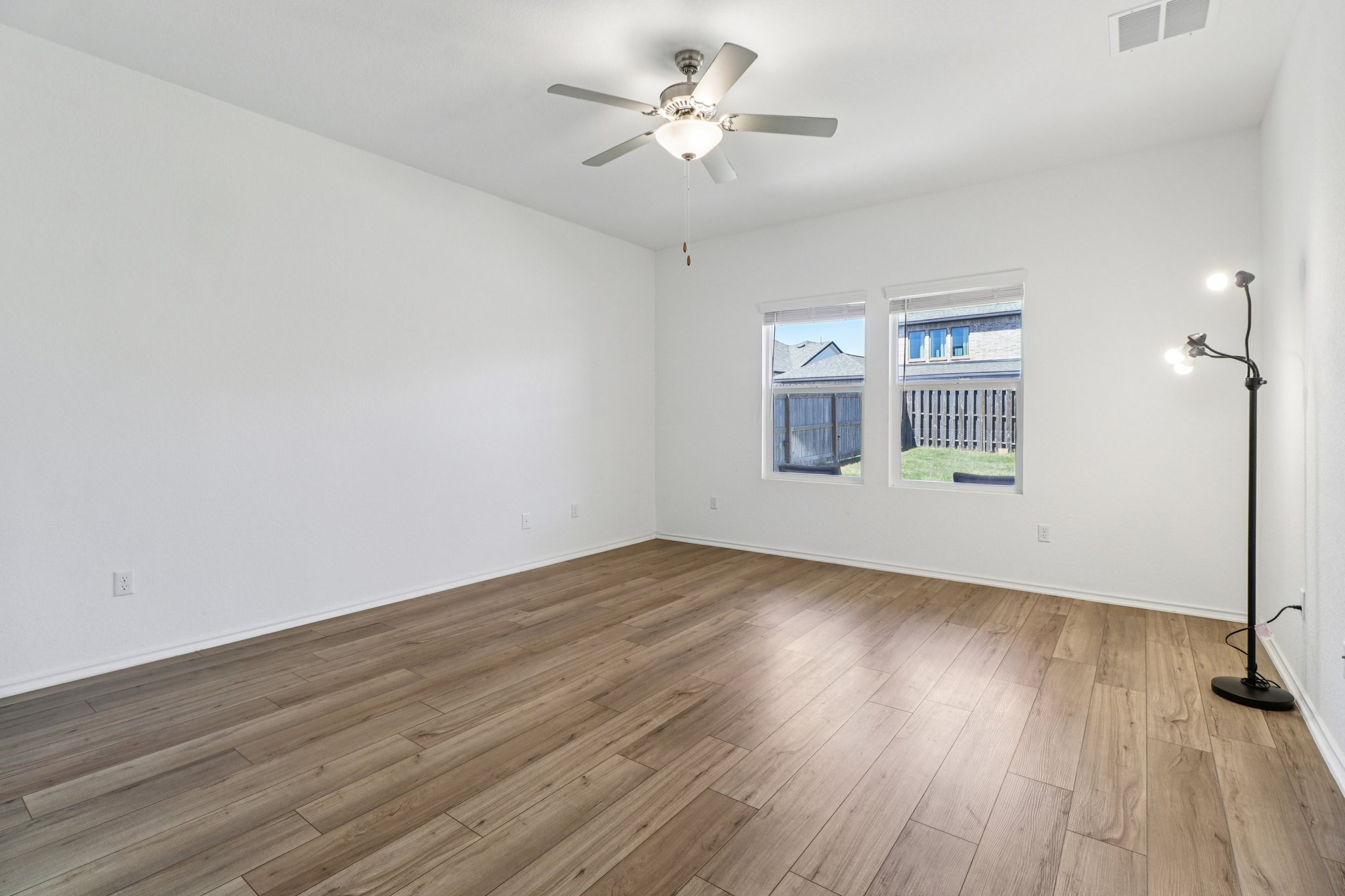1201 Mallow Road Leander, TX 78641 - Photo 18 of 40 Unfurnished room featuring ceiling fan and wood finished floors