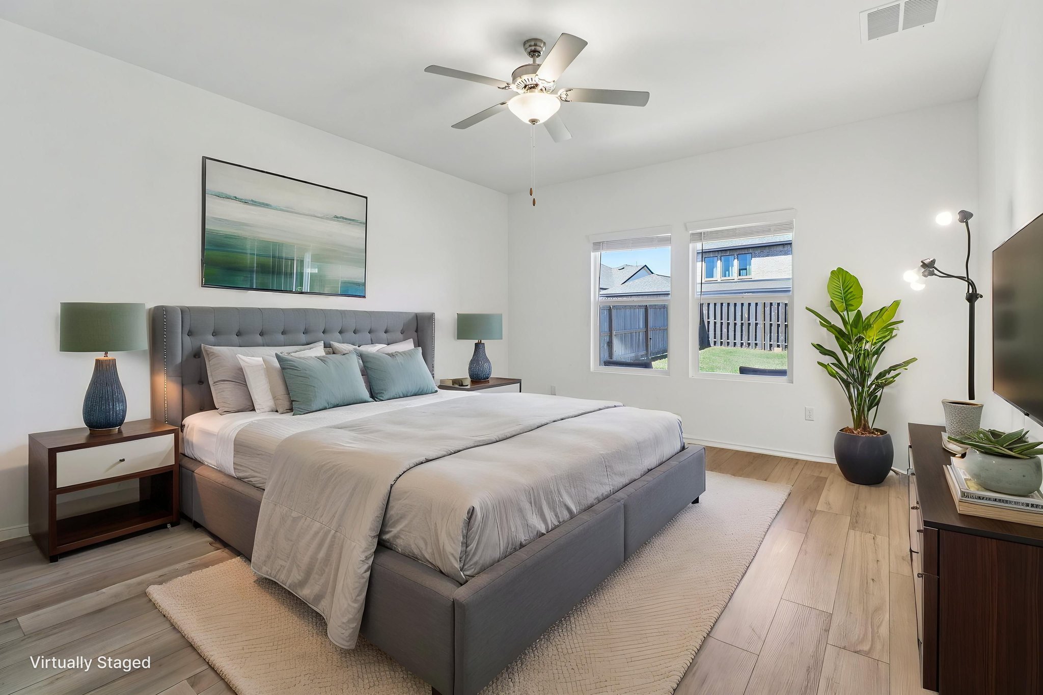 1201 Mallow Road Leander, TX 78641 - Photo 19 of 40 Bedroom featuring light wood finished floors and a ceiling fan