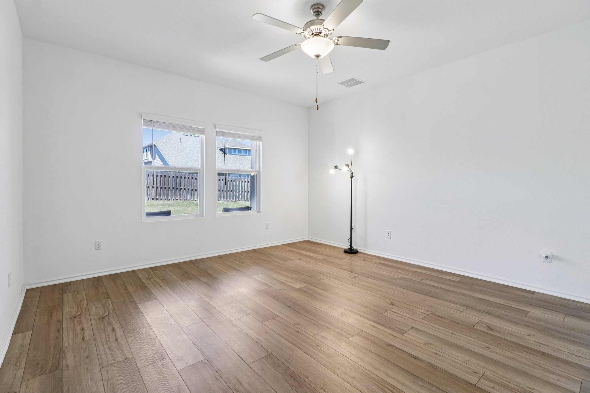 1201 Mallow Road Leander, TX 78641 - Photo 20 of 40 Unfurnished room with ceiling fan and light wood-style flooring