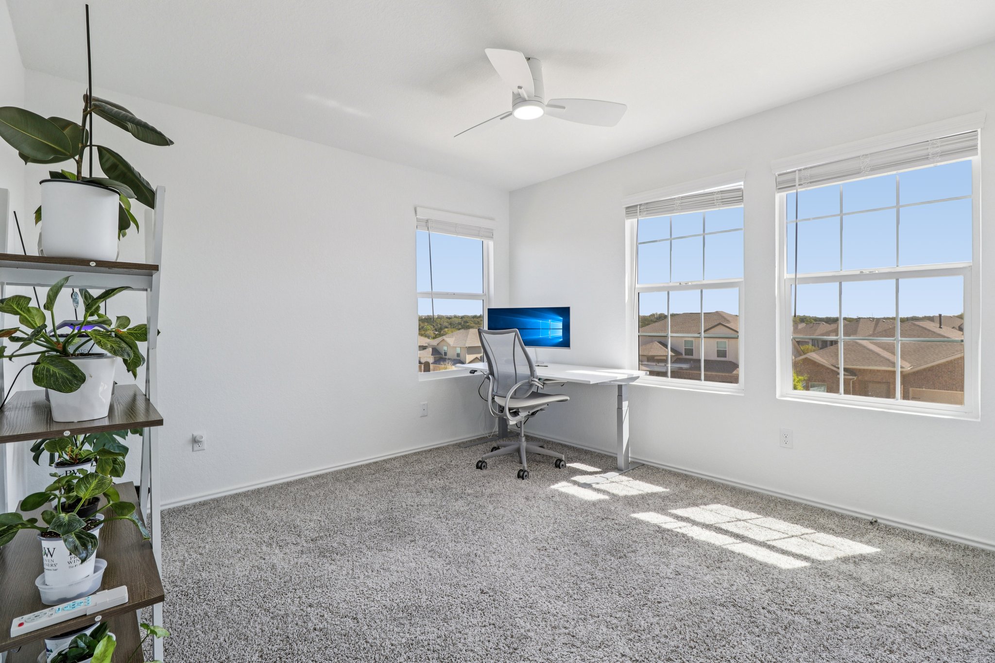 1201 Mallow Road Leander, TX 78641 - Photo 30 of 40 Carpeted office space with a ceiling fan and baseboards