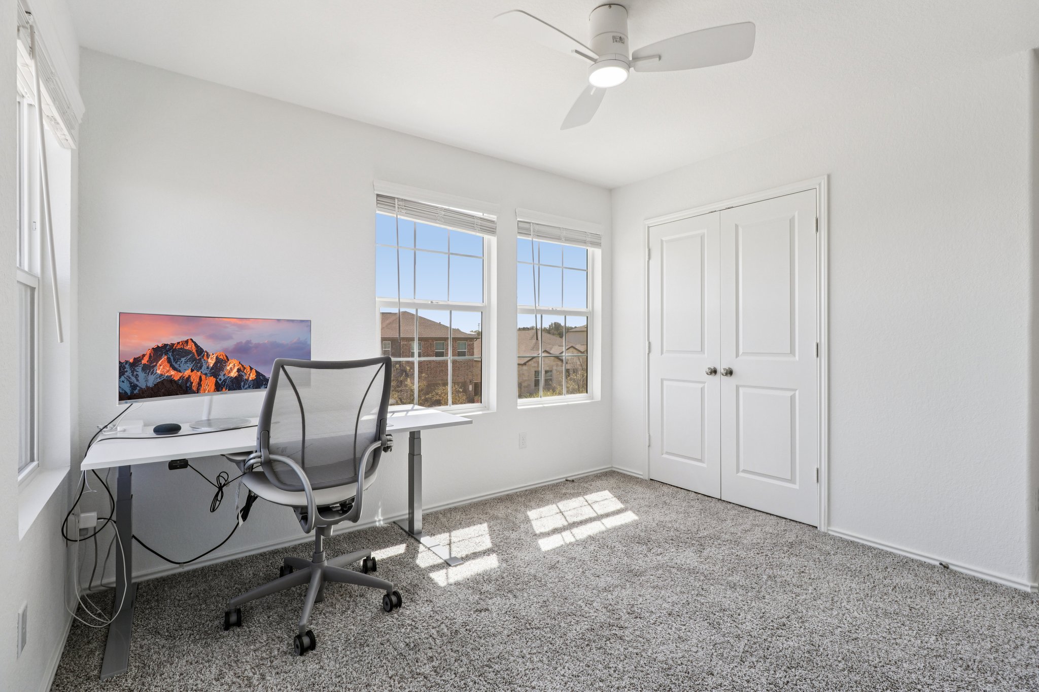 1201 Mallow Road Leander, TX 78641 - Photo 31 of 40 Home office with light colored carpet and a ceiling fan