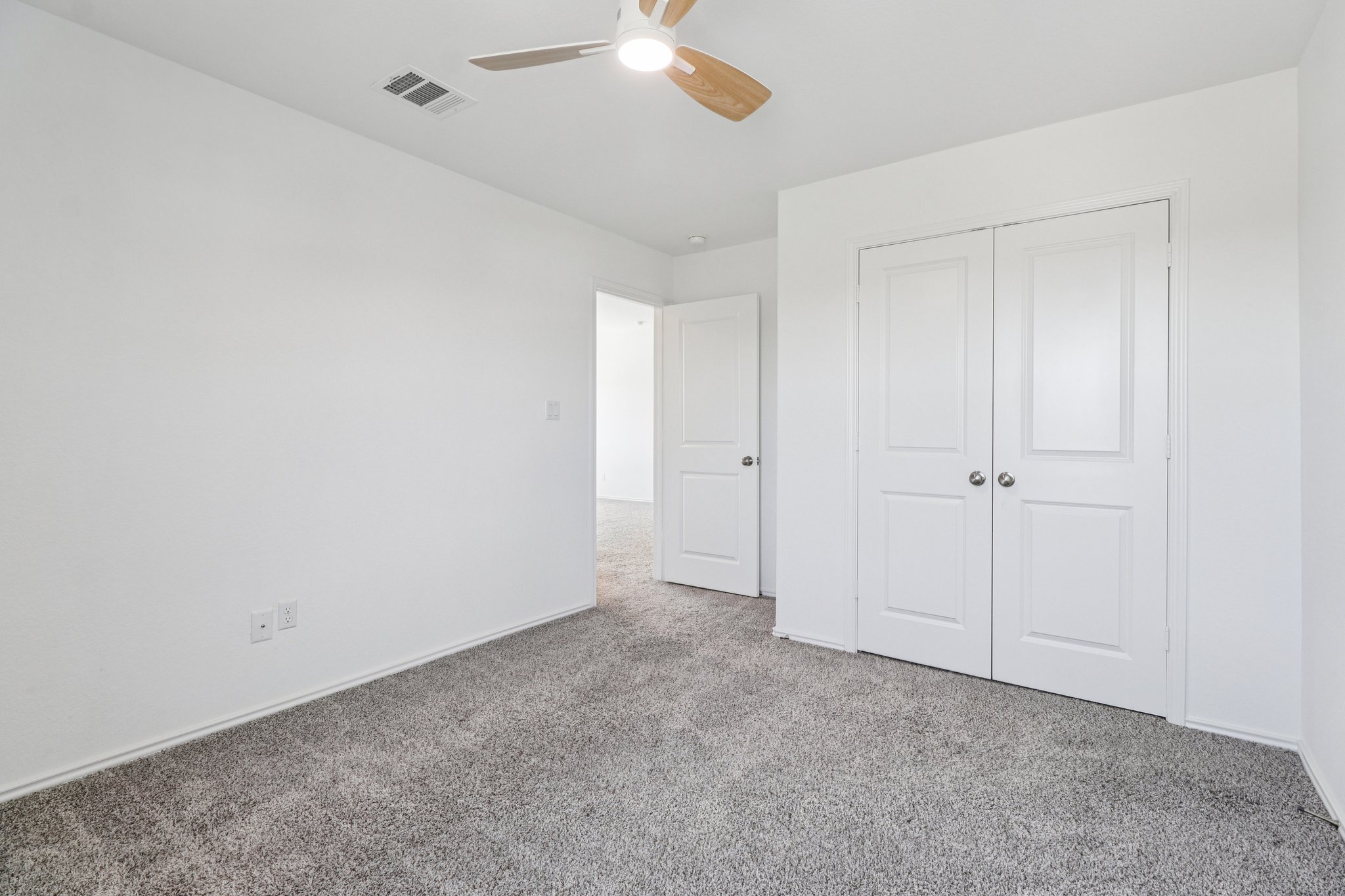 1201 Mallow Road Leander, TX 78641 - Photo 33 of 40 Unfurnished bedroom featuring carpet, a closet, and ceiling fan
