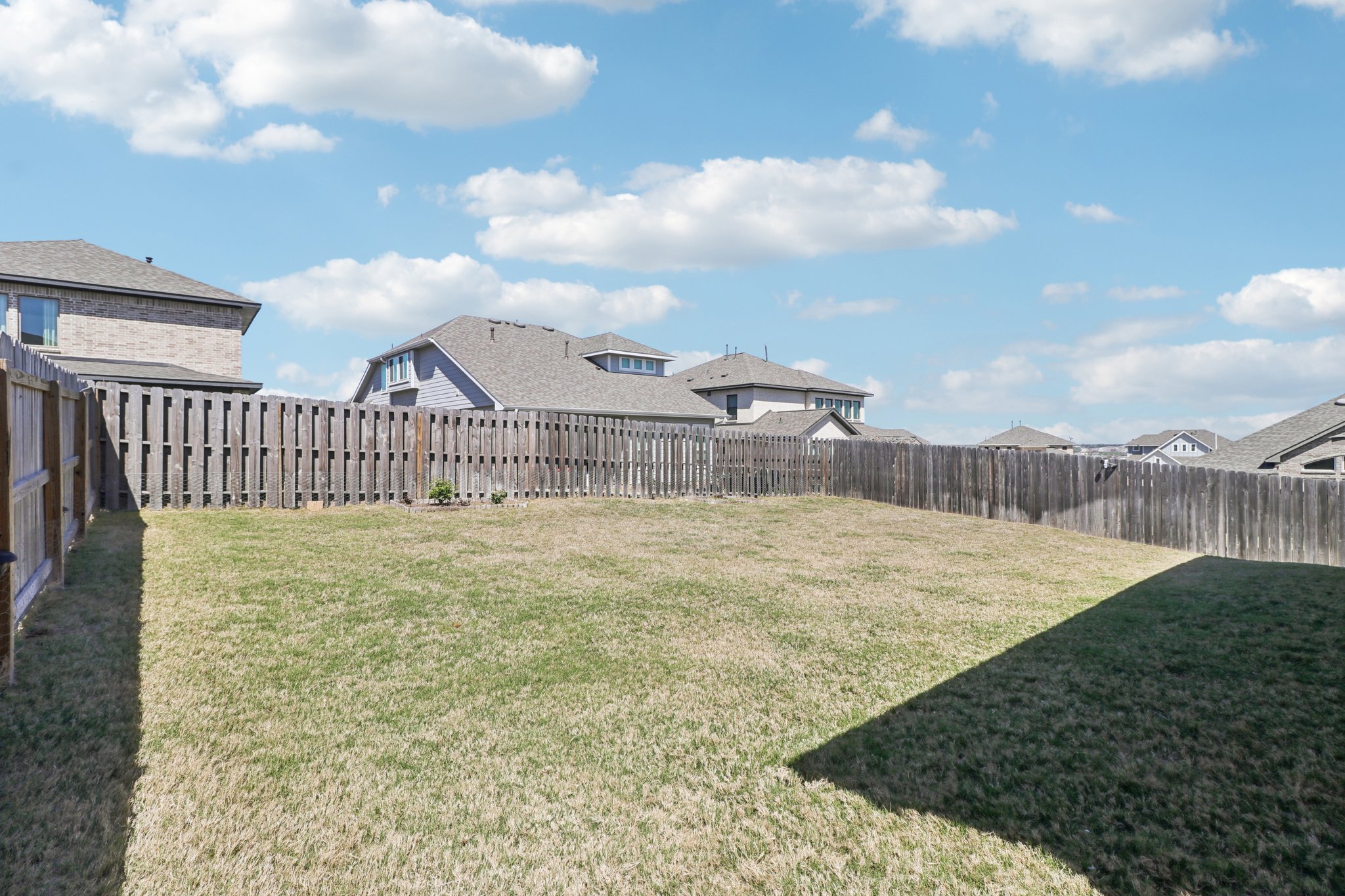 1201 Mallow Road Leander, TX 78641 - Photo 37 of 40 Fenced backyard featuring a residential view