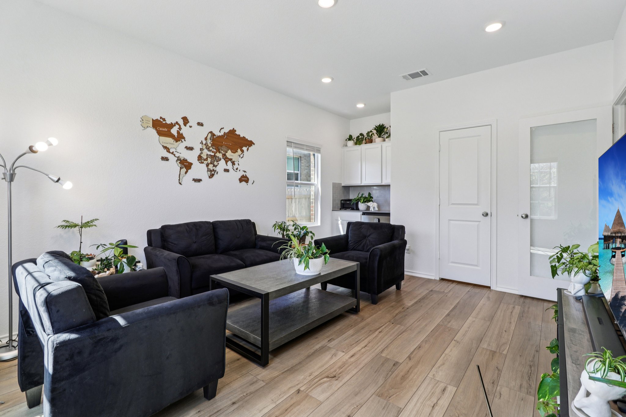 1201 Mallow Road Leander, TX 78641 - Photo 7 of 40 Living room with light wood finished floors and recessed lighting