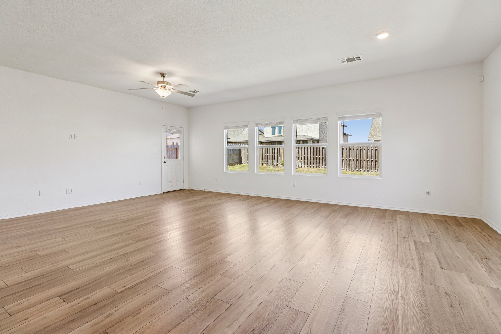 1201 Mallow Road Leander, TX 78641 - Photo 10 of 40 Empty room featuring a ceiling fan and light wood-type flooring