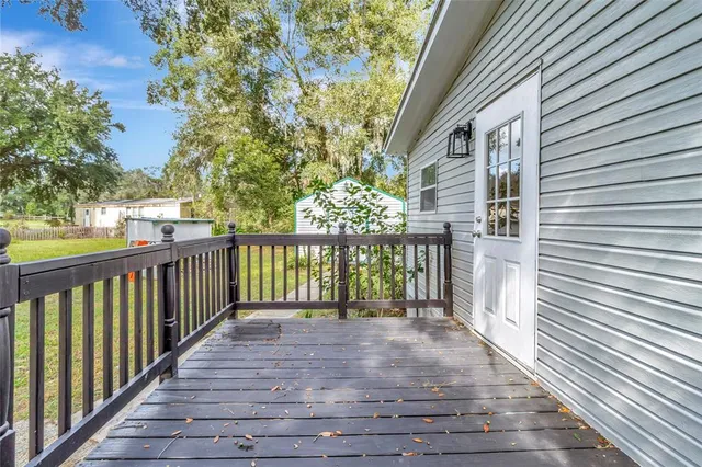 a view of a pathway with a wrought fence