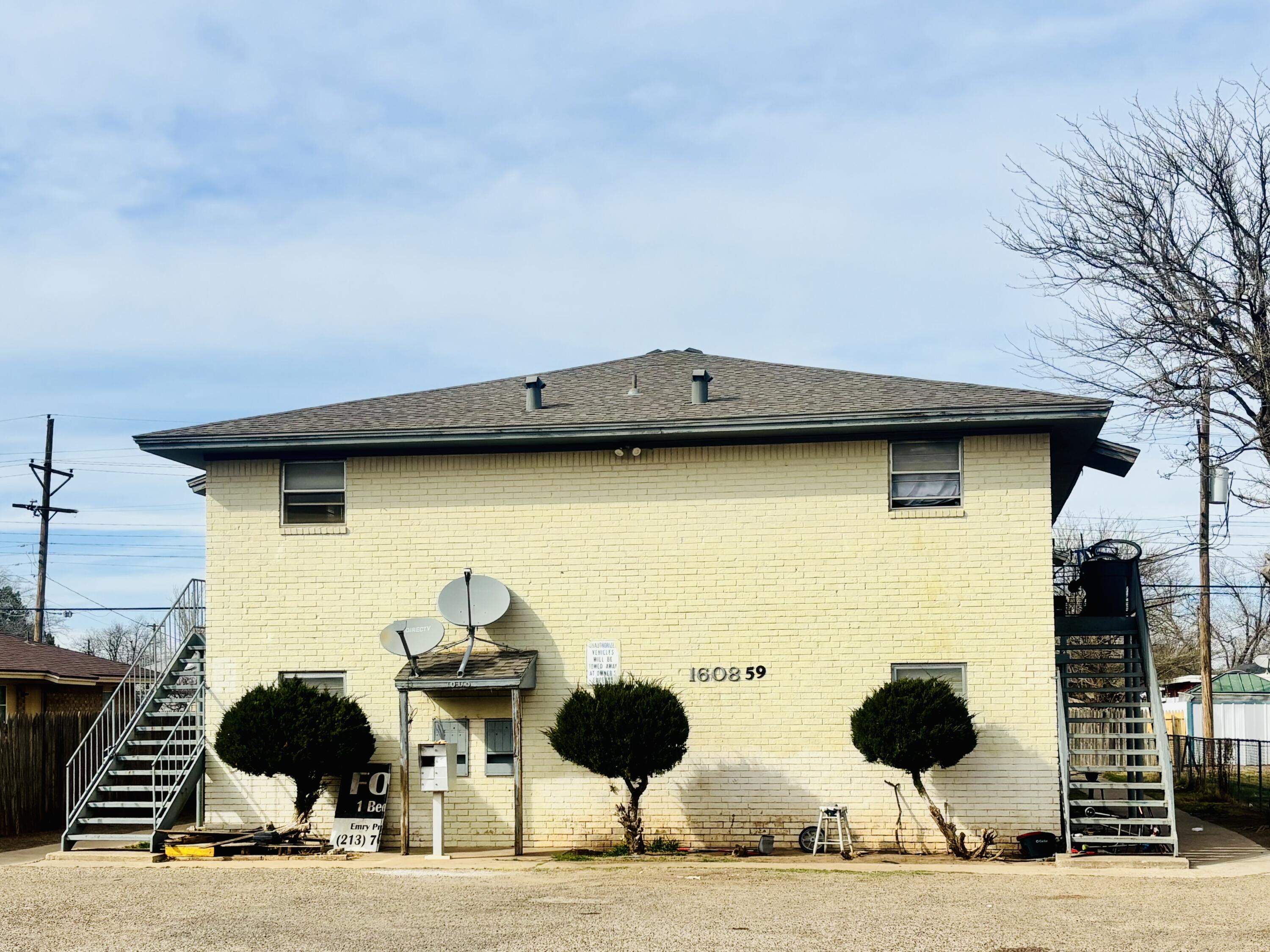 1608 59th Street Lubbock, TX 79412 - Photo 1 of 9 a view of a two chairs and table in the back yard