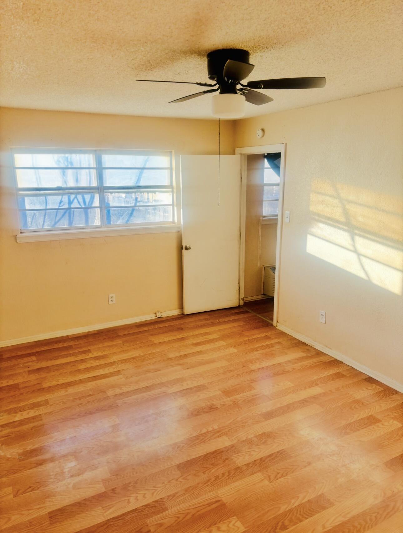 1608 59th Street Lubbock, TX 79412 - Photo 9 of 9 a view of an empty room with a window