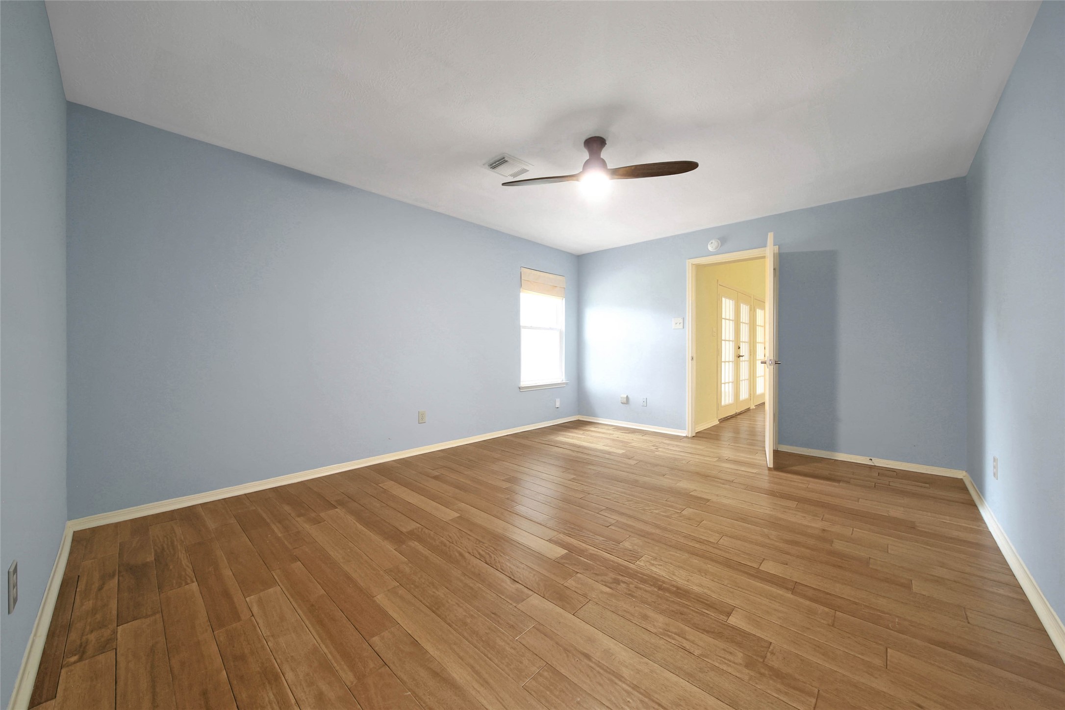 5010 Cupids Bower Court Spring, TX 77388 - Photo 14 of 40 a view of empty room with wooden floor and fan