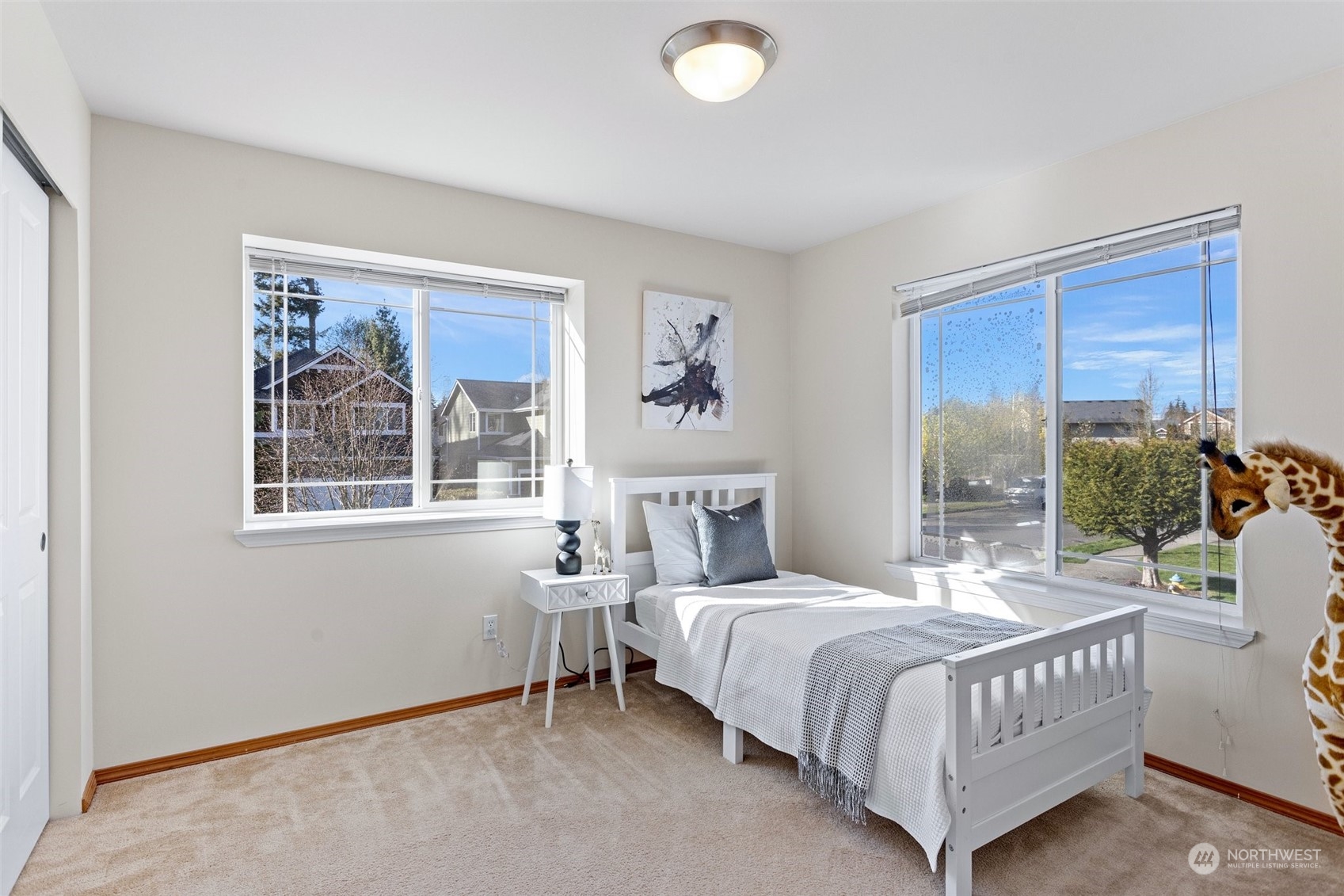 15317 Sunset Road Bothell, WA 98012 - Photo 11 of 24 a bedroom with a large bed and a window