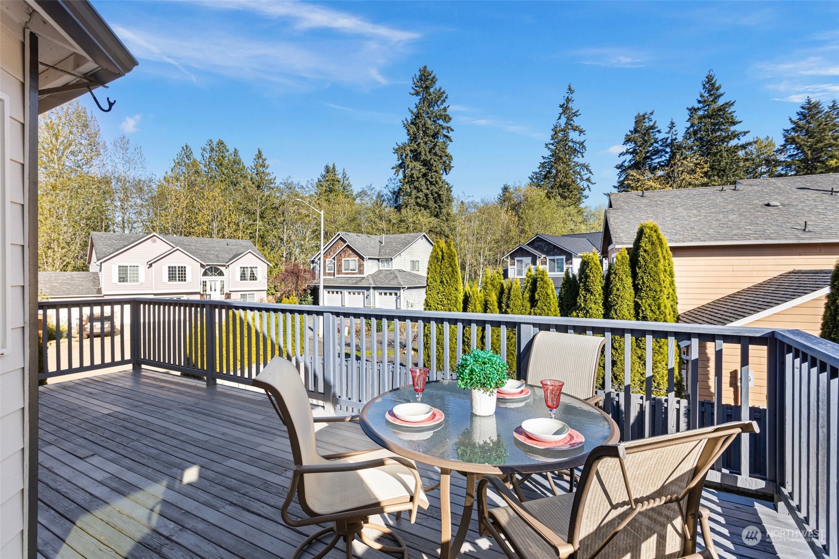 15317 Sunset Road Bothell, WA 98012 - Photo 16 of 24 a view of a balcony with furniture and wooden floor