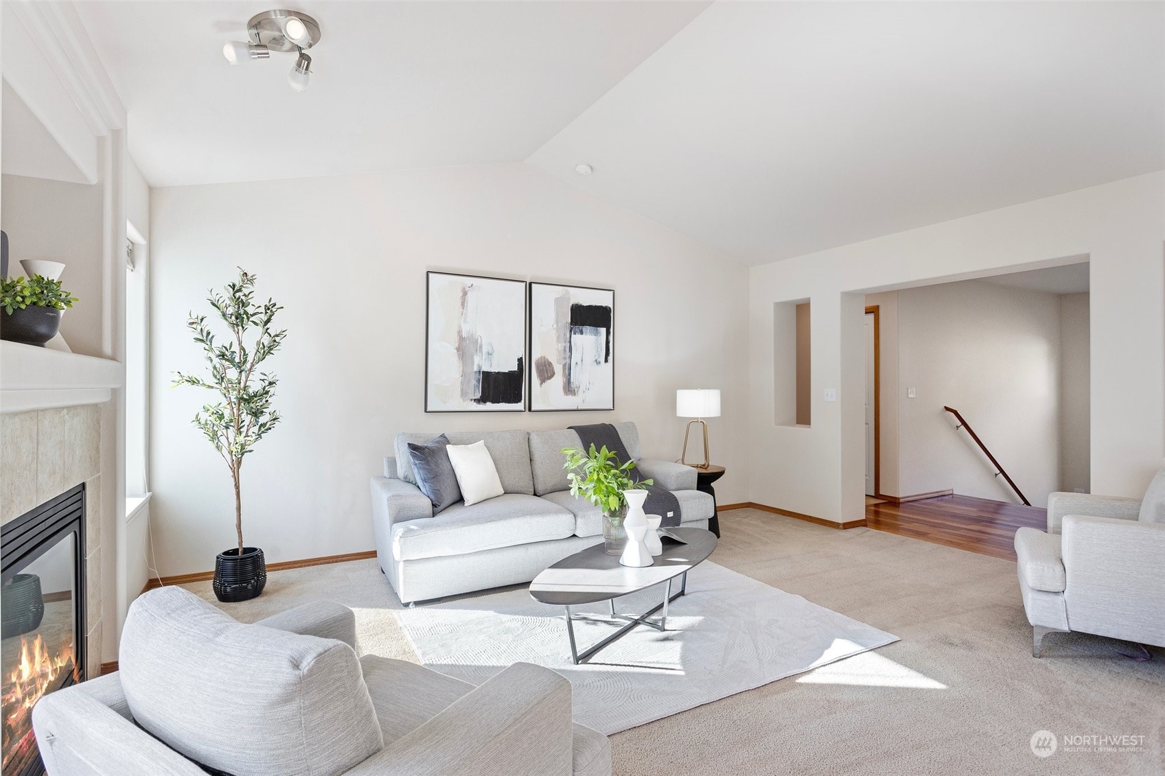 15317 Sunset Road Bothell, WA 98012 - Photo 3 of 24 a living room with furniture and a potted plant