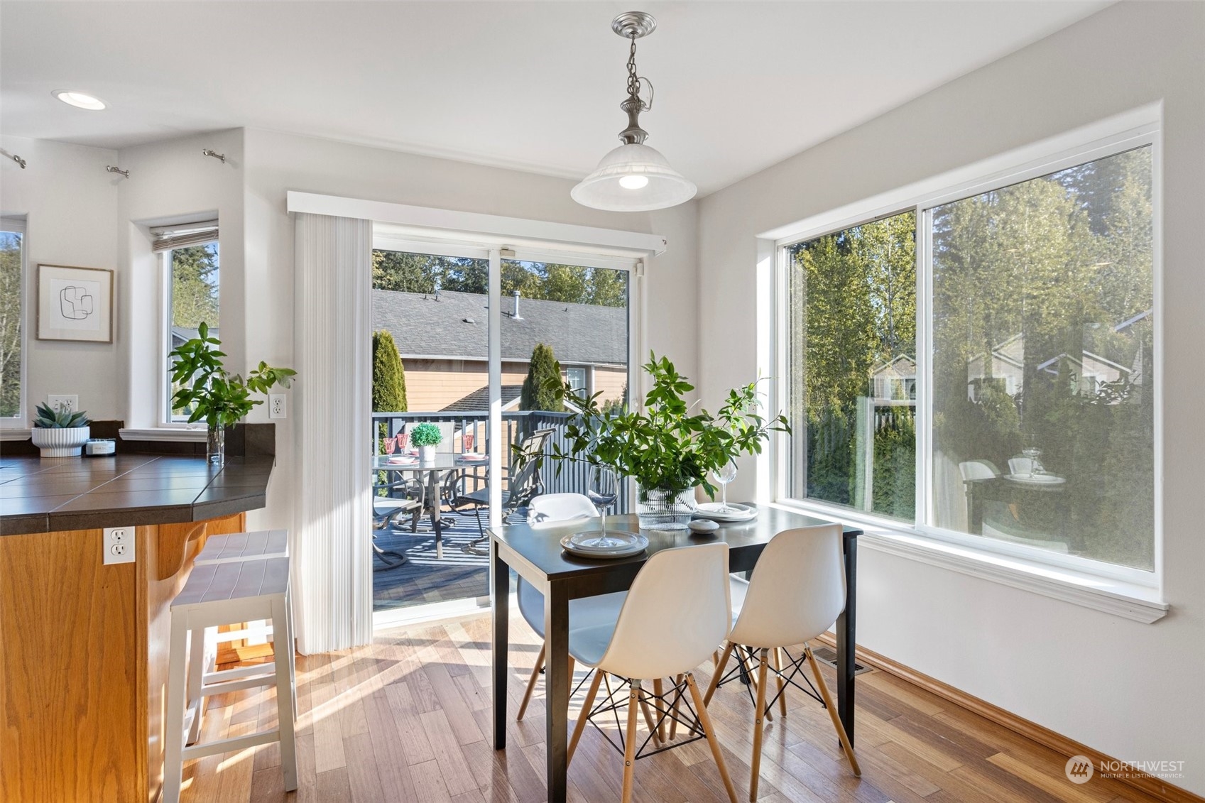 15317 Sunset Road Bothell, WA 98012 - Photo 5 of 24 a dining room with furniture window wooden floor