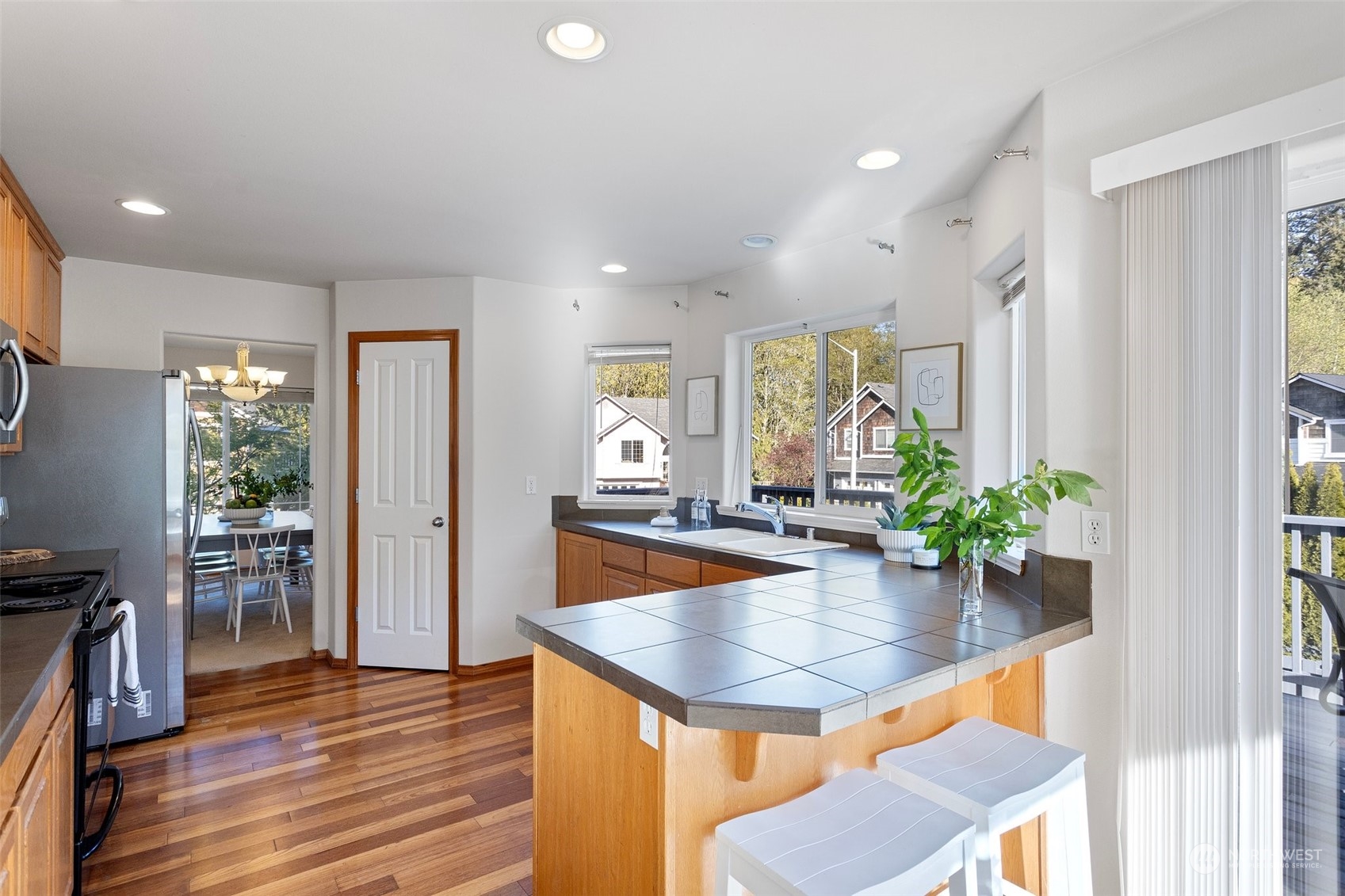 15317 Sunset Road Bothell, WA 98012 - Photo 6 of 24 a kitchen with sink and refrigerator