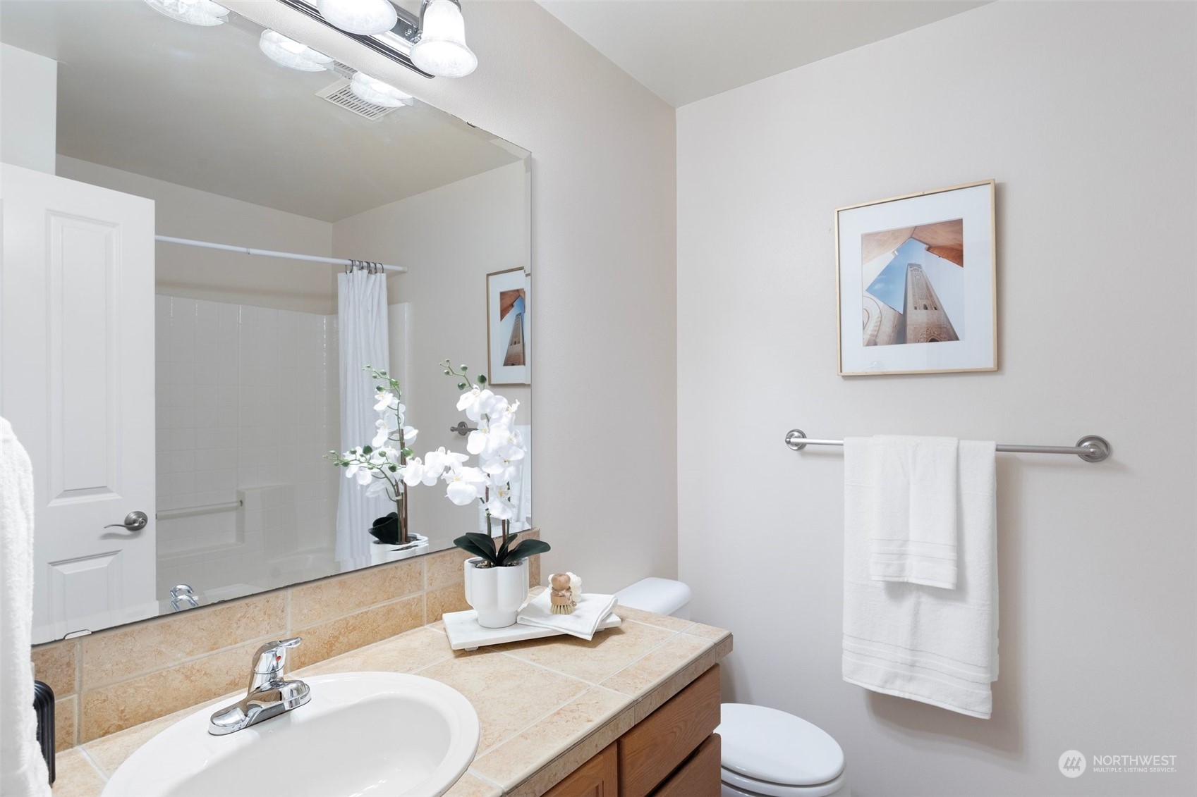 15317 Sunset Road Bothell, WA 98012 - Photo 9 of 24 a bathroom with a toilet sink and mirror