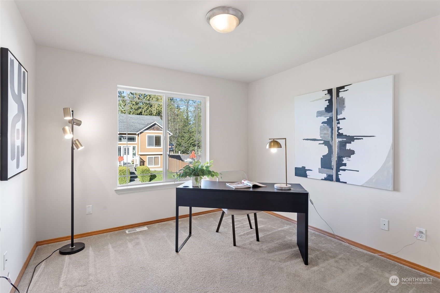 15317 Sunset Road Bothell, WA 98012 - Photo 10 of 24 a view of a workspace with furniture and a window