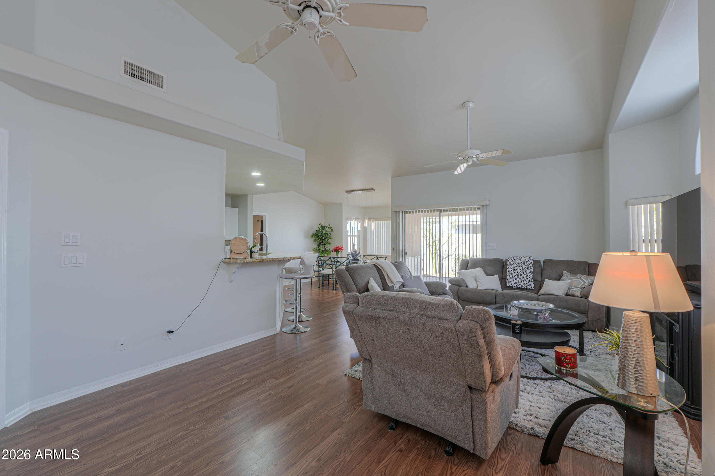 5830 East McKellips Road, Unit 27 Mesa, AZ 85215 - Photo 11 of 47 a living room with furniture and a table