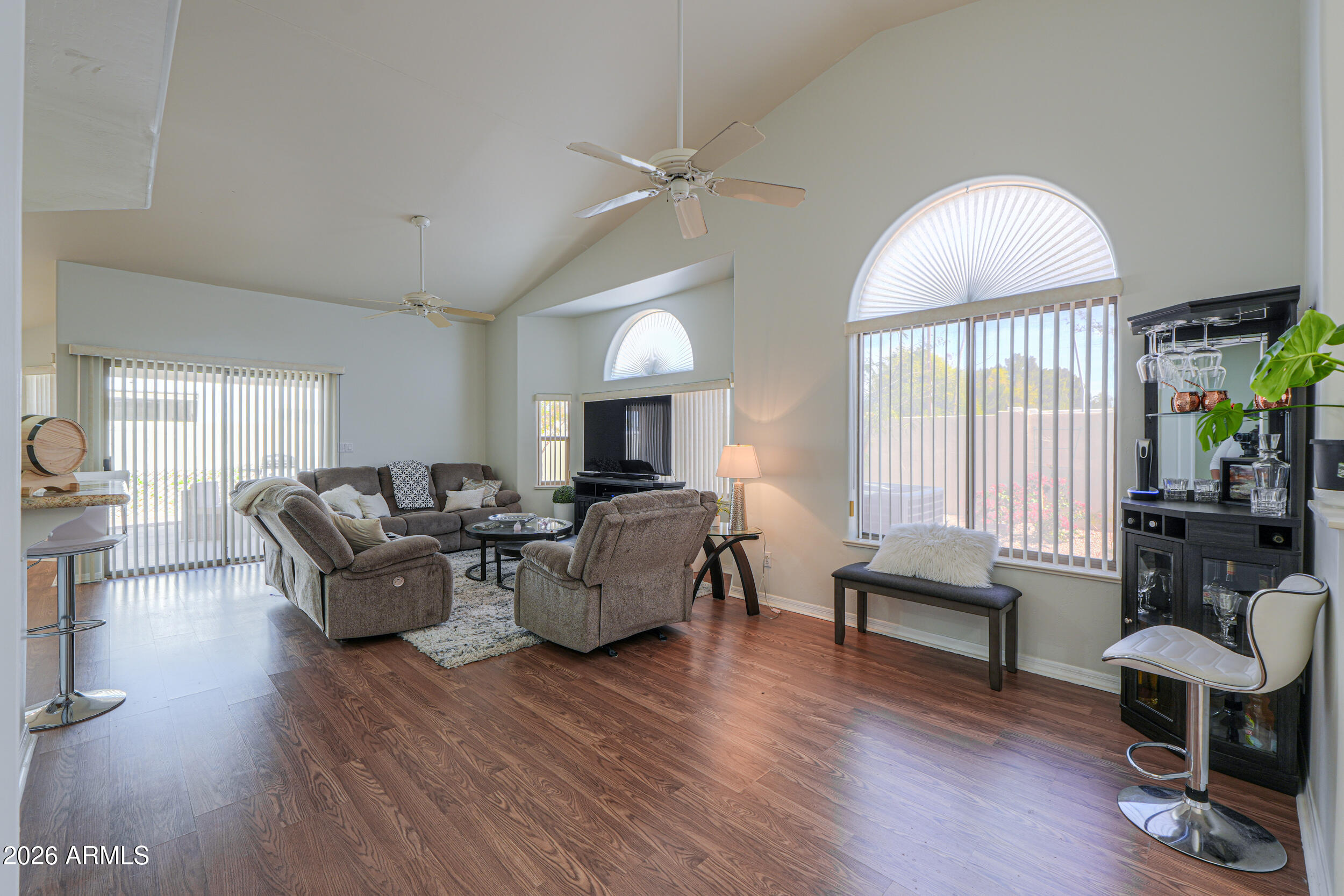 5830 East McKellips Road, Unit 27 Mesa, AZ 85215 - Photo 12 of 47 a living room with fireplace furniture and a wooden floor
