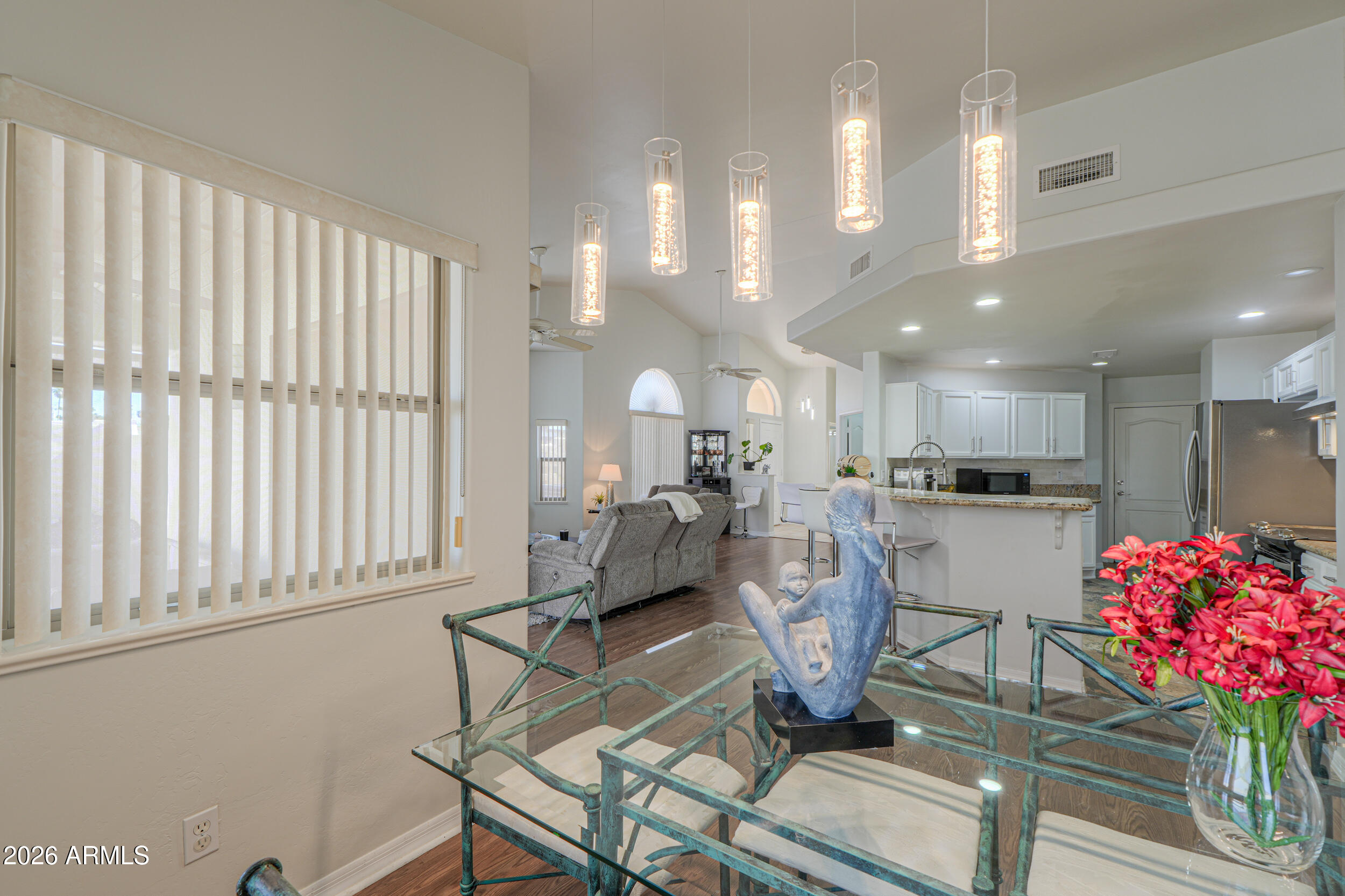 5830 East McKellips Road, Unit 27 Mesa, AZ 85215 - Photo 16 of 47 a living room with furniture and flowers
