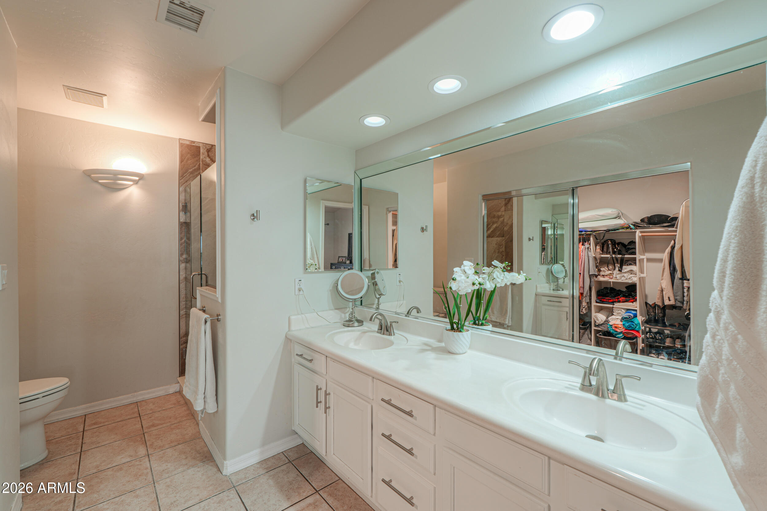 5830 East McKellips Road, Unit 27 Mesa, AZ 85215 - Photo 20 of 47 a bathroom with a double vanity sink toilet and shower