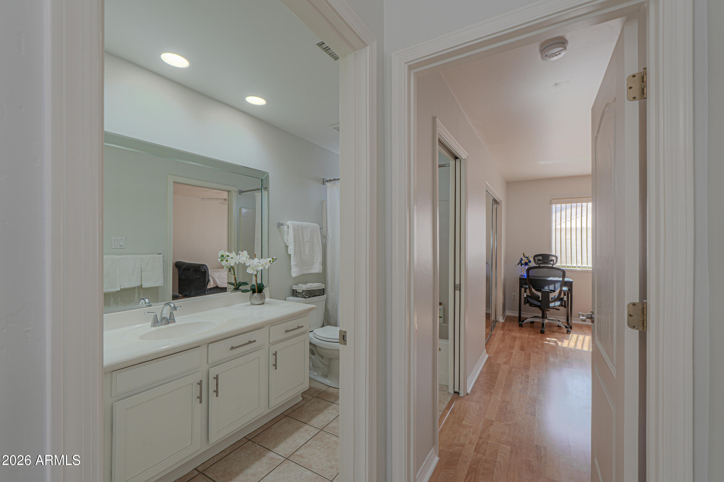 5830 East McKellips Road, Unit 27 Mesa, AZ 85215 - Photo 26 of 47 a en suite bathroom with a granite countertop sink and a mirror