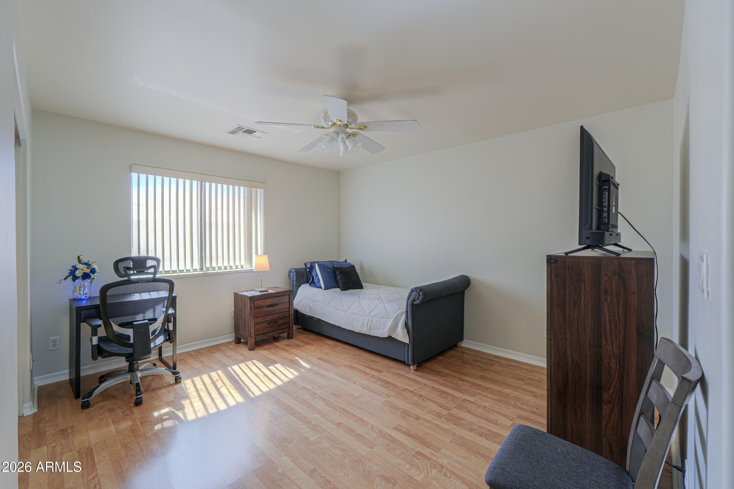 5830 East McKellips Road, Unit 27 Mesa, AZ 85215 - Photo 27 of 47 a living room with furniture and a wooden floor