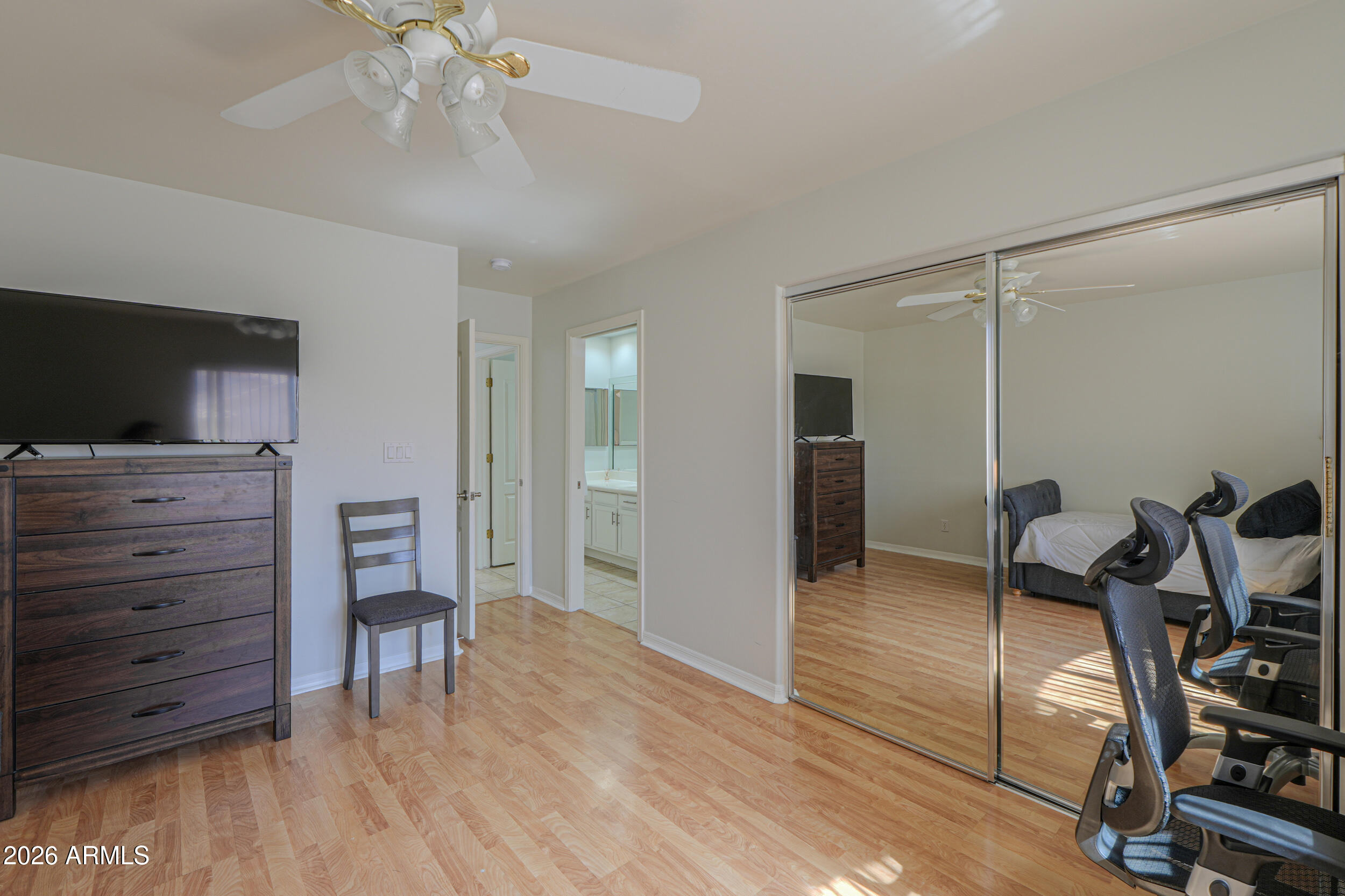 5830 East McKellips Road, Unit 27 Mesa, AZ 85215 - Photo 28 of 47 a view of a livingroom with furniture and wooden floor