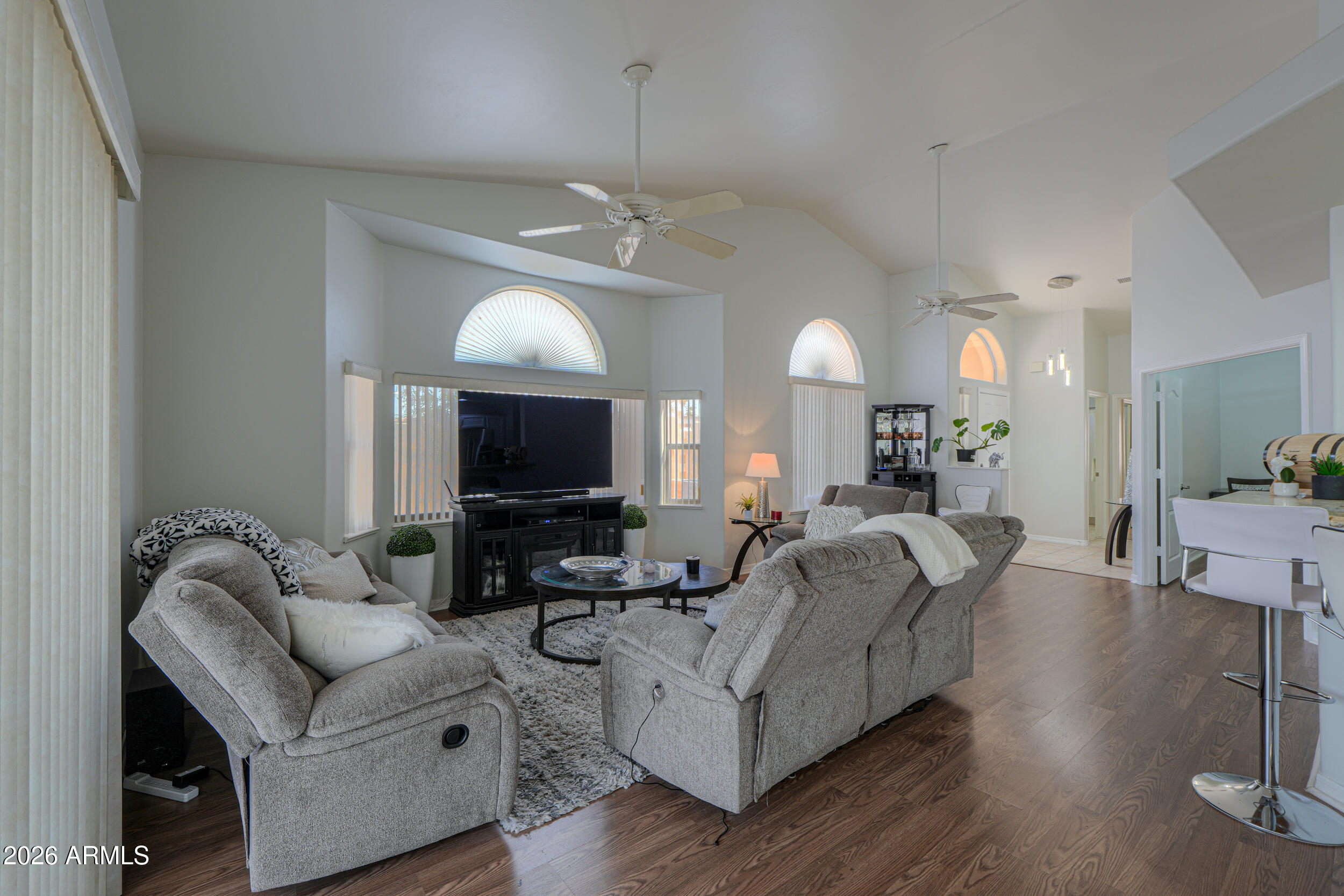 5830 East McKellips Road, Unit 27 Mesa, AZ 85215 - Photo 2 of 47 a living room with furniture fireplace and flat screen tv