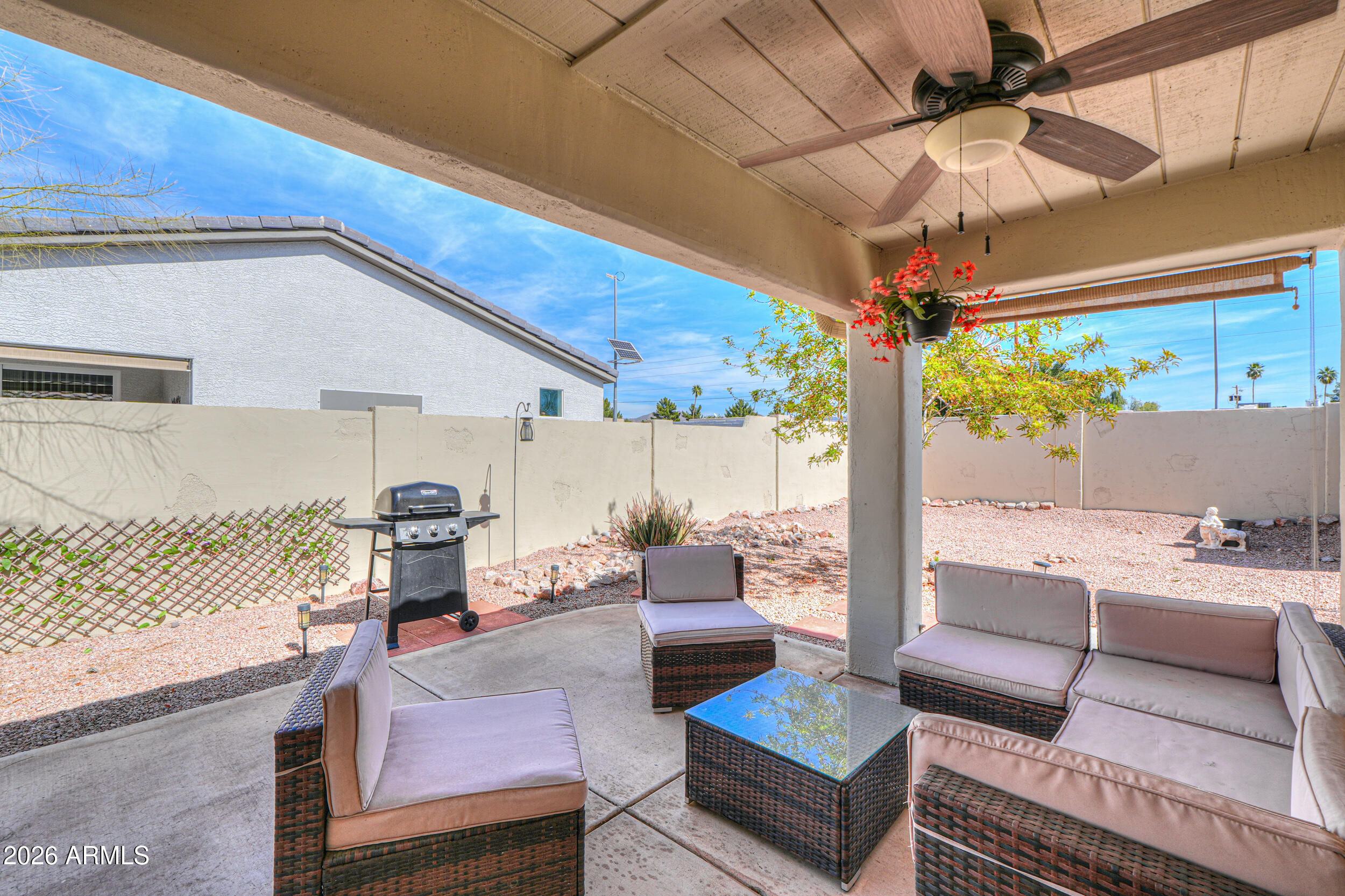 5830 East McKellips Road, Unit 27 Mesa, AZ 85215 - Photo 32 of 47 a outdoor living space with patio furniture