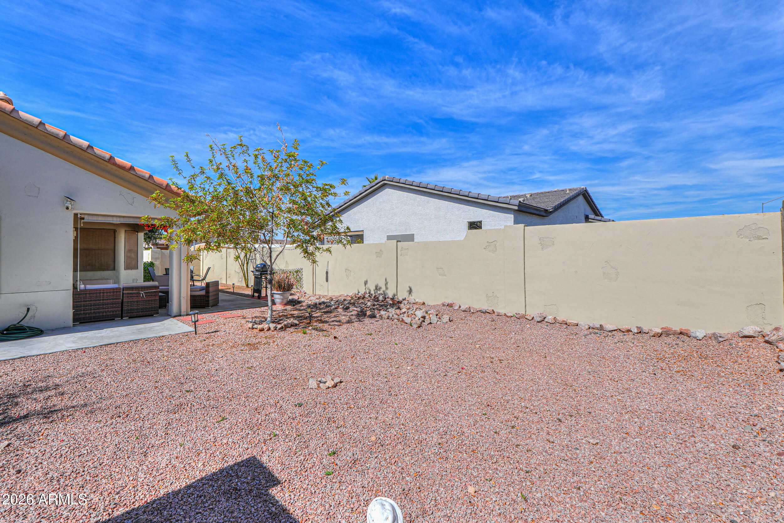 5830 East McKellips Road, Unit 27 Mesa, AZ 85215 - Photo 36 of 47 a view of a house with a patio