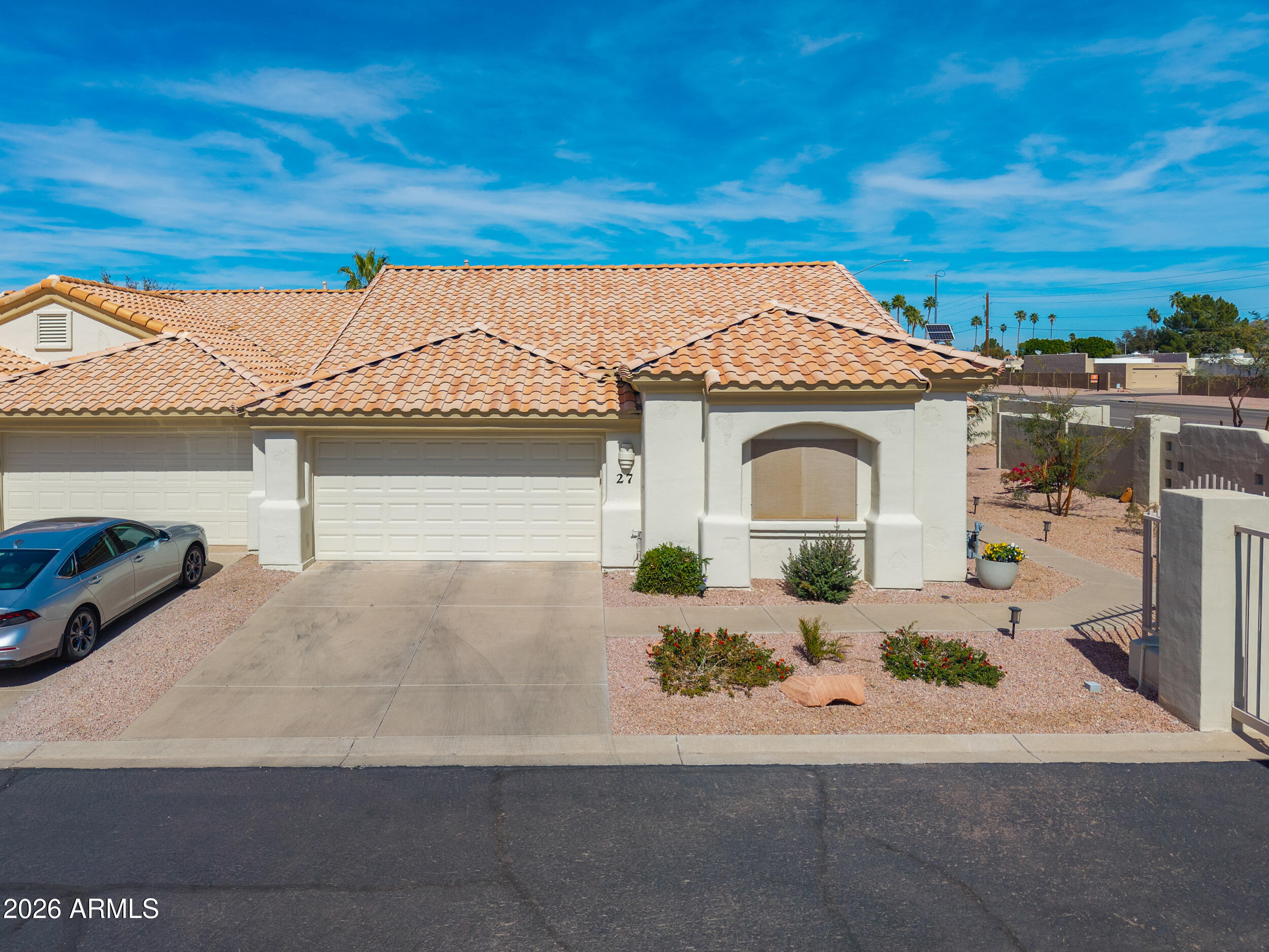 5830 East McKellips Road, Unit 27 Mesa, AZ 85215 - Photo 40 of 47 a front view of a house with a yard