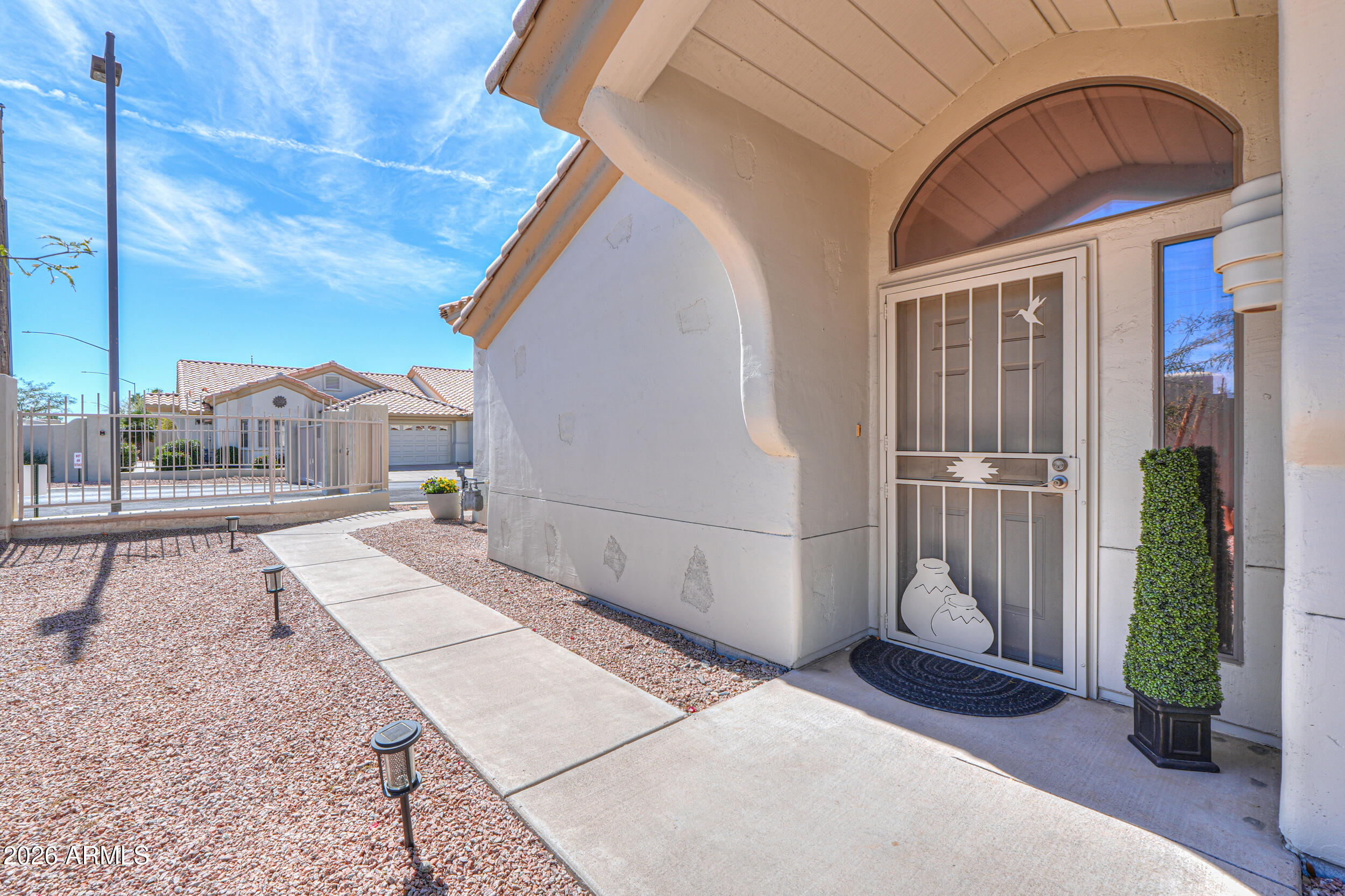5830 East McKellips Road, Unit 27 Mesa, AZ 85215 - Photo 8 of 47 a view of a house with backyard and porch