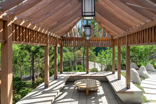a view of a house with a backyard and sitting area