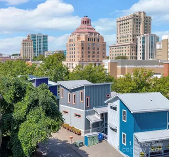 a front view of a residential apartment building with a yard