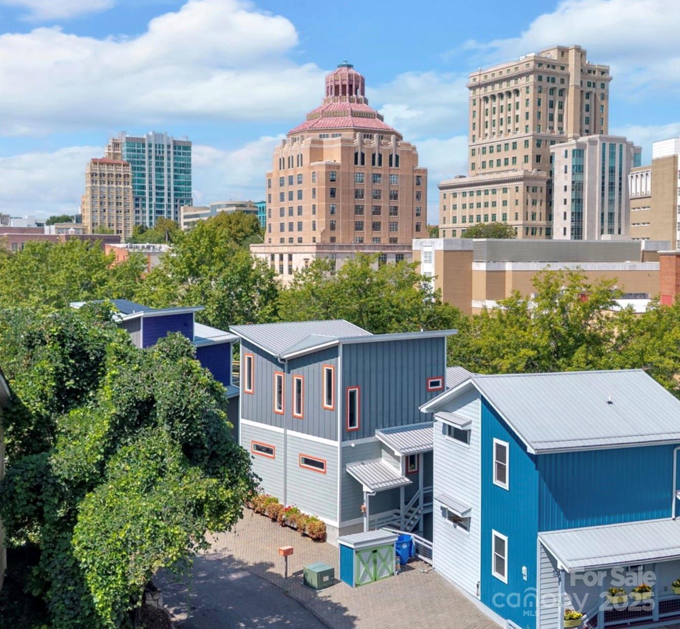 a front view of a residential apartment building with a yard